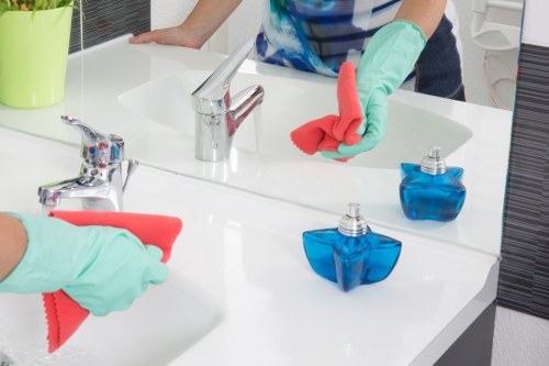 Upholstery cleaning equipment used on a fabric sofa in E9