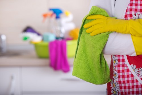 Technician inspecting a cleaned carpet after a complaint