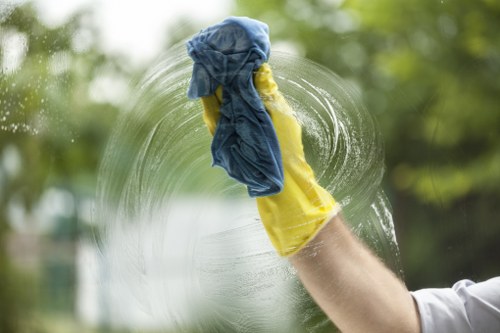 Technician cleaning a sofa in a local East London property